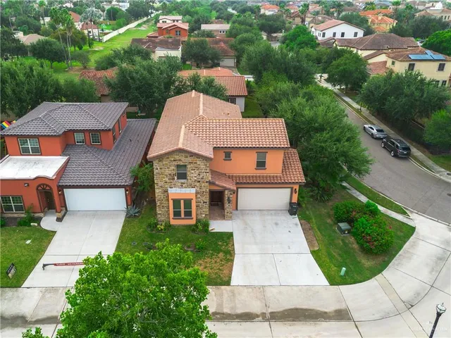 an aerial view of a house with garden