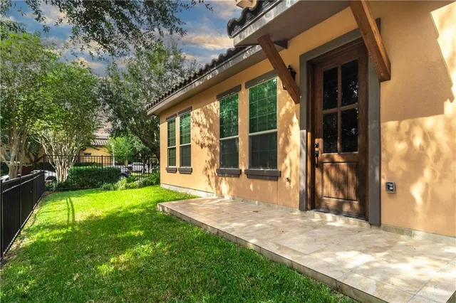 a view of a backyard with a garden and trees
