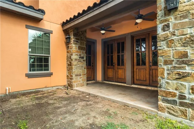 a view of a brick house with a large window
