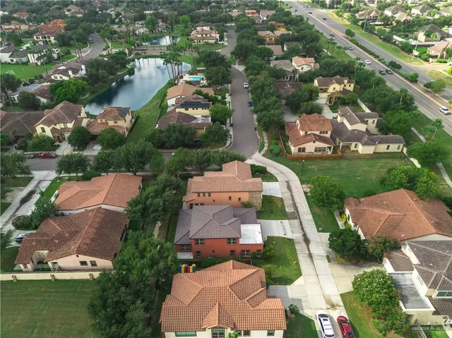 an aerial view of residential houses with outdoor space and street view