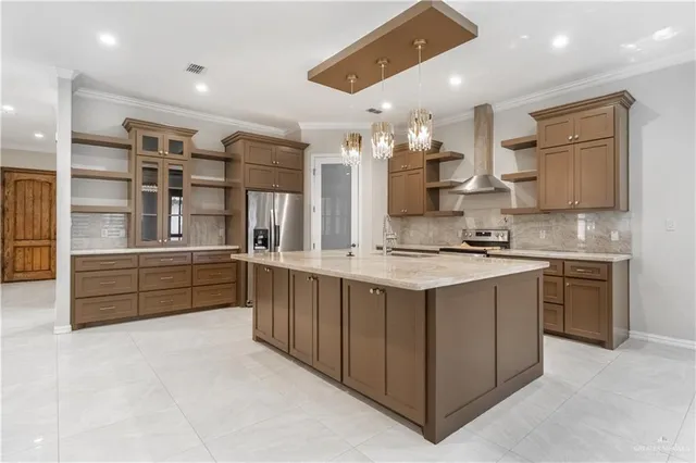 a kitchen with stainless steel appliances granite countertop a sink and cabinets
