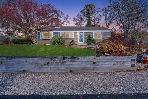 a front view of a house with a yard
