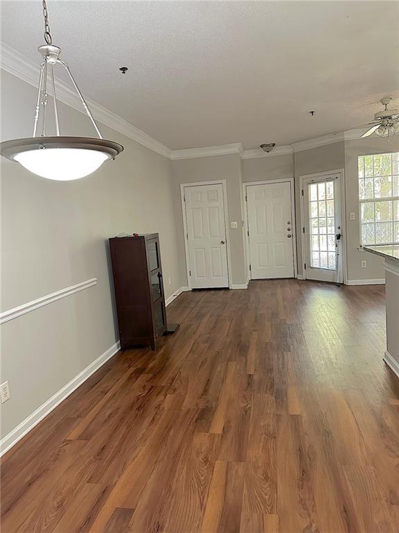 245 Amal Drive Southwest, Unit 2008 Atlanta, GA 30315 - Photo 5 of 23 an empty room with wooden floor and windows