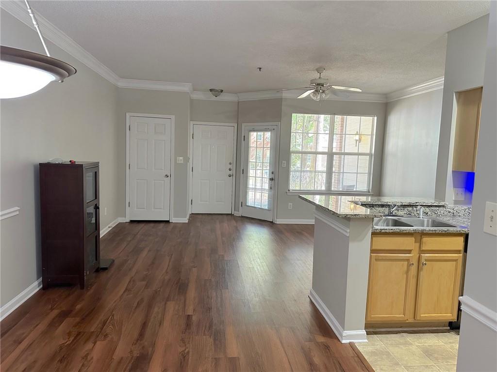 245 Amal Drive Southwest, Unit 2008 Atlanta, GA 30315 - Photo 6 of 23 an empty room with wooden floor and windows