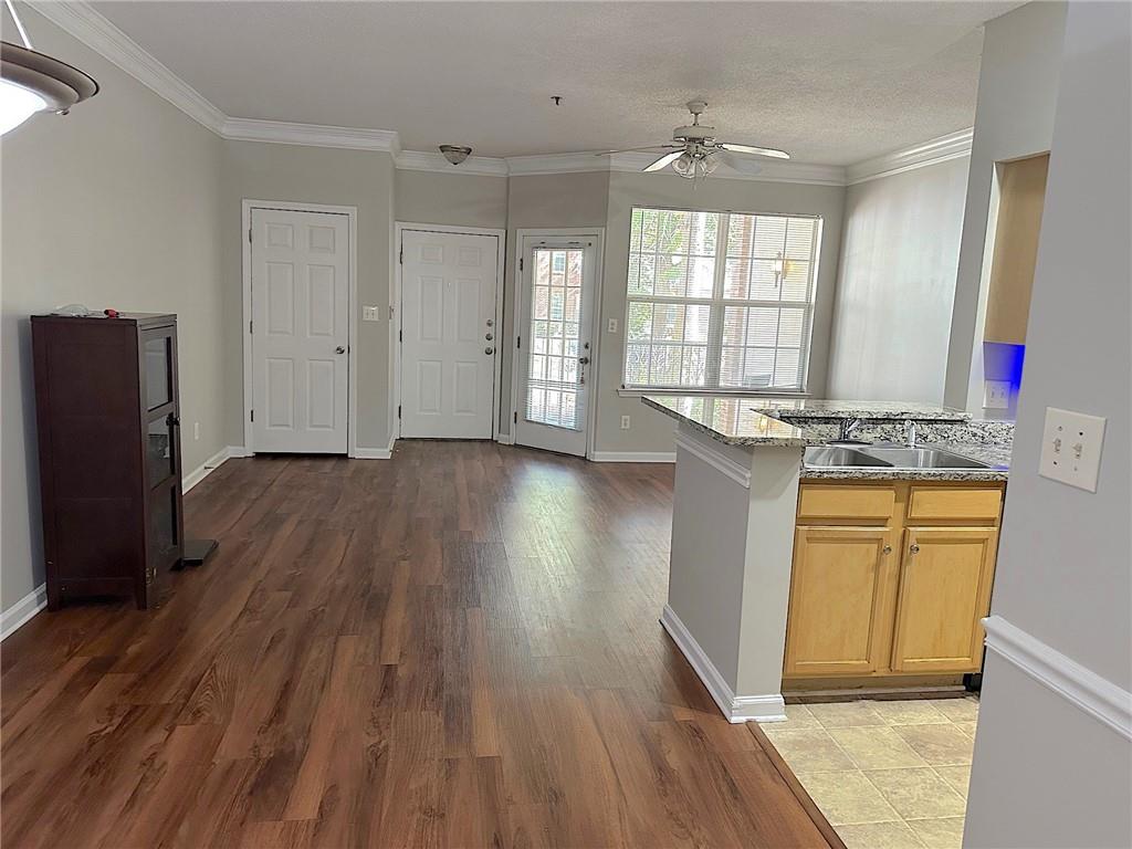 245 Amal Drive Southwest, Unit 2008 Atlanta, GA 30315 - Photo 7 of 23 a view of a kitchen with wooden floor and a window