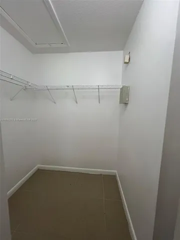 a view of a room with racks on the wall