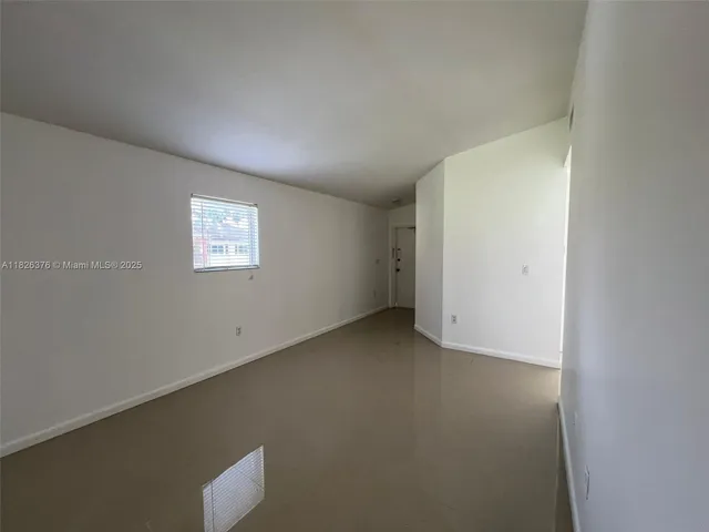 a view of a room that has a window in it