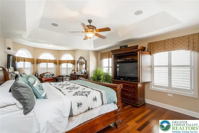 a bedroom with a bed and a lamp