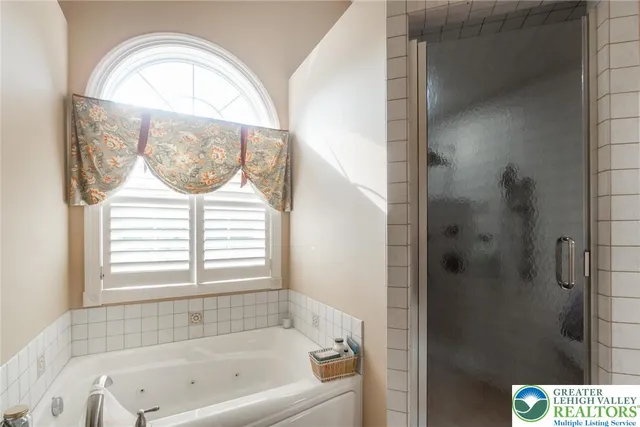 a white toilet sitting next to a shower