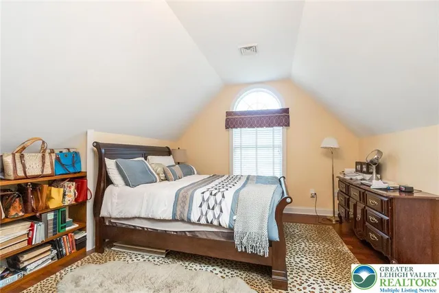 a view of a garden with large trees