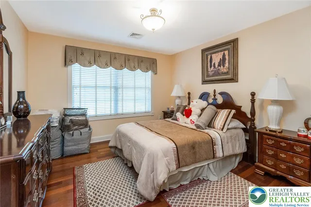 a view of a tree in a backyard of a house