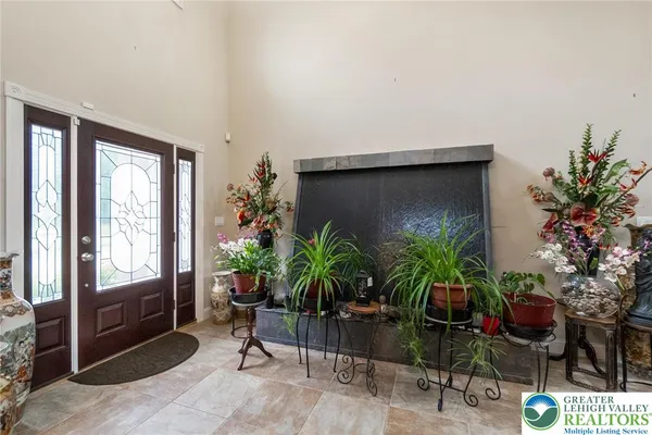 a living room with furniture potted plant and a potted plant