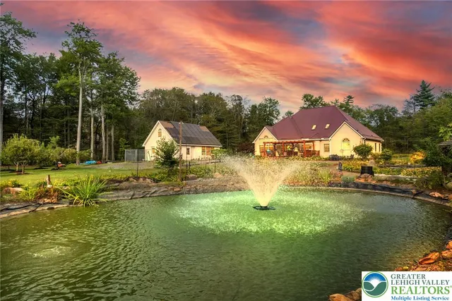 a living room with furniture and flowers