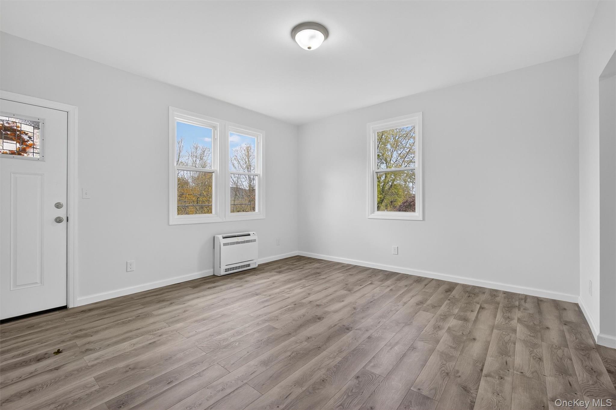 322 Old Rte 22 Pawling, NY 12564 - Photo 19 of 50 an empty room with wooden floor and windows