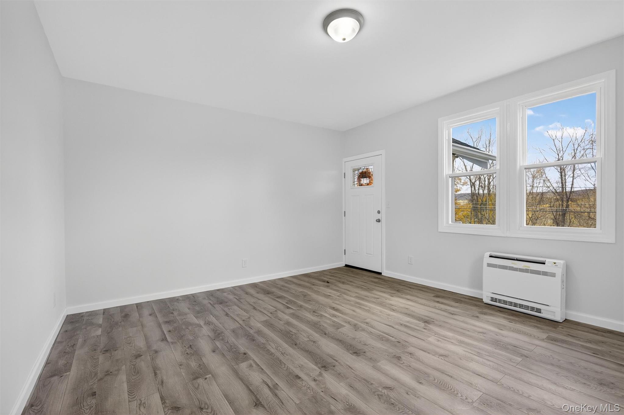 322 Old Rte 22 Pawling, NY 12564 - Photo 20 of 50 an empty room with wooden floor and windows