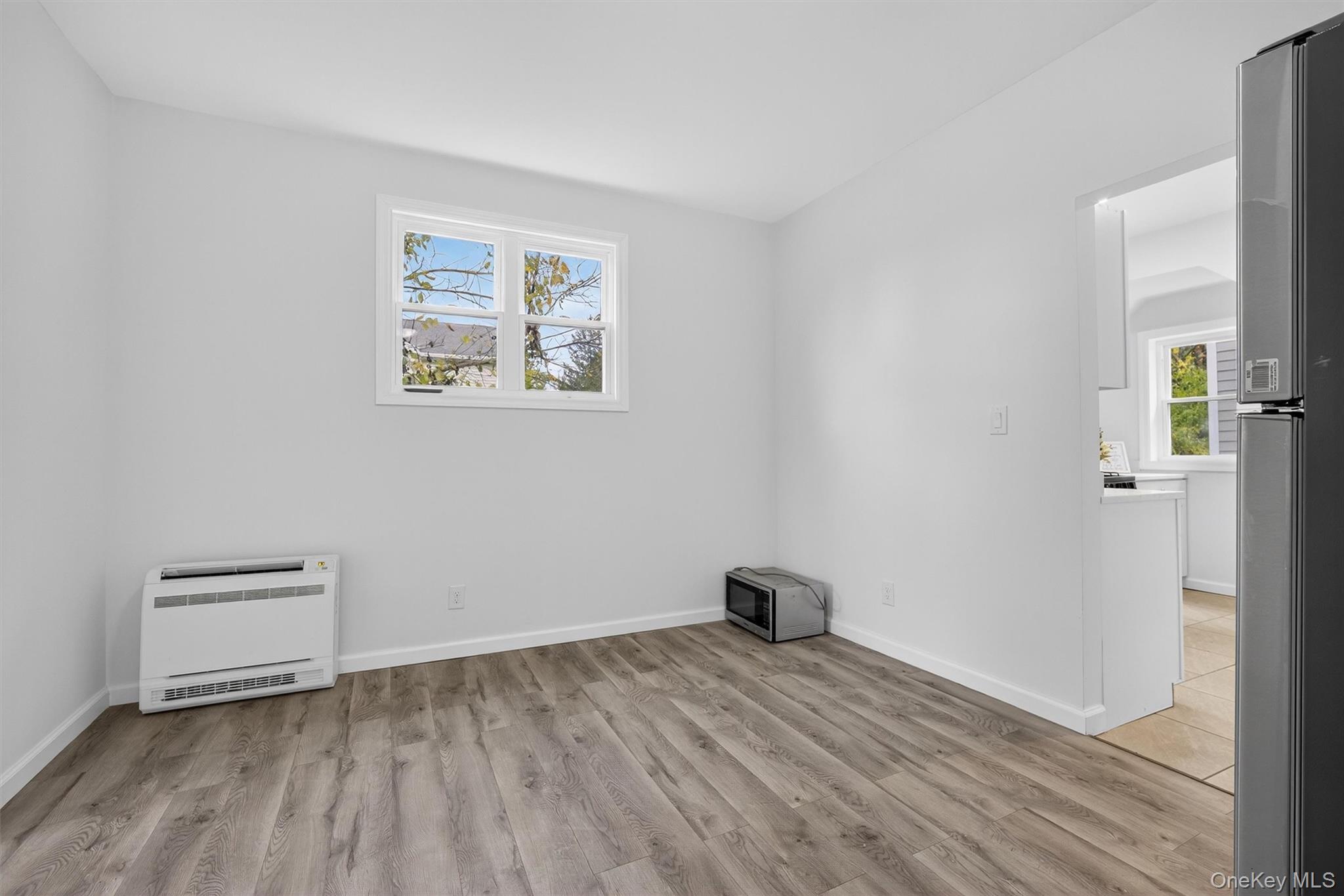 322 Old Rte 22 Pawling, NY 12564 - Photo 23 of 50 a view of an empty room with wooden floor and a window