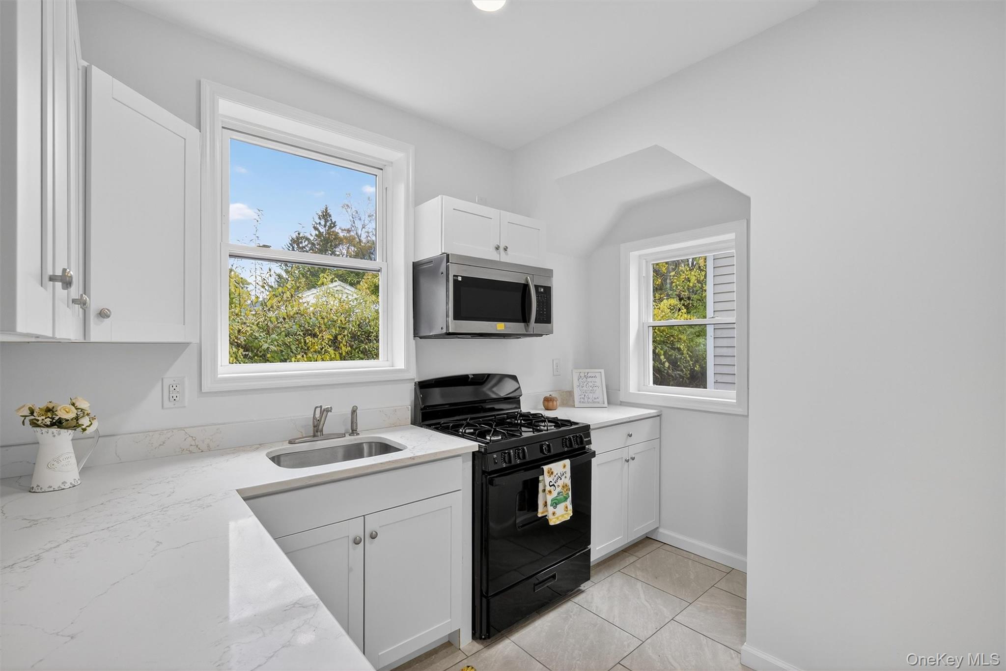 322 Old Rte 22 Pawling, NY 12564 - Photo 24 of 50 a kitchen with a stove a sink and a window