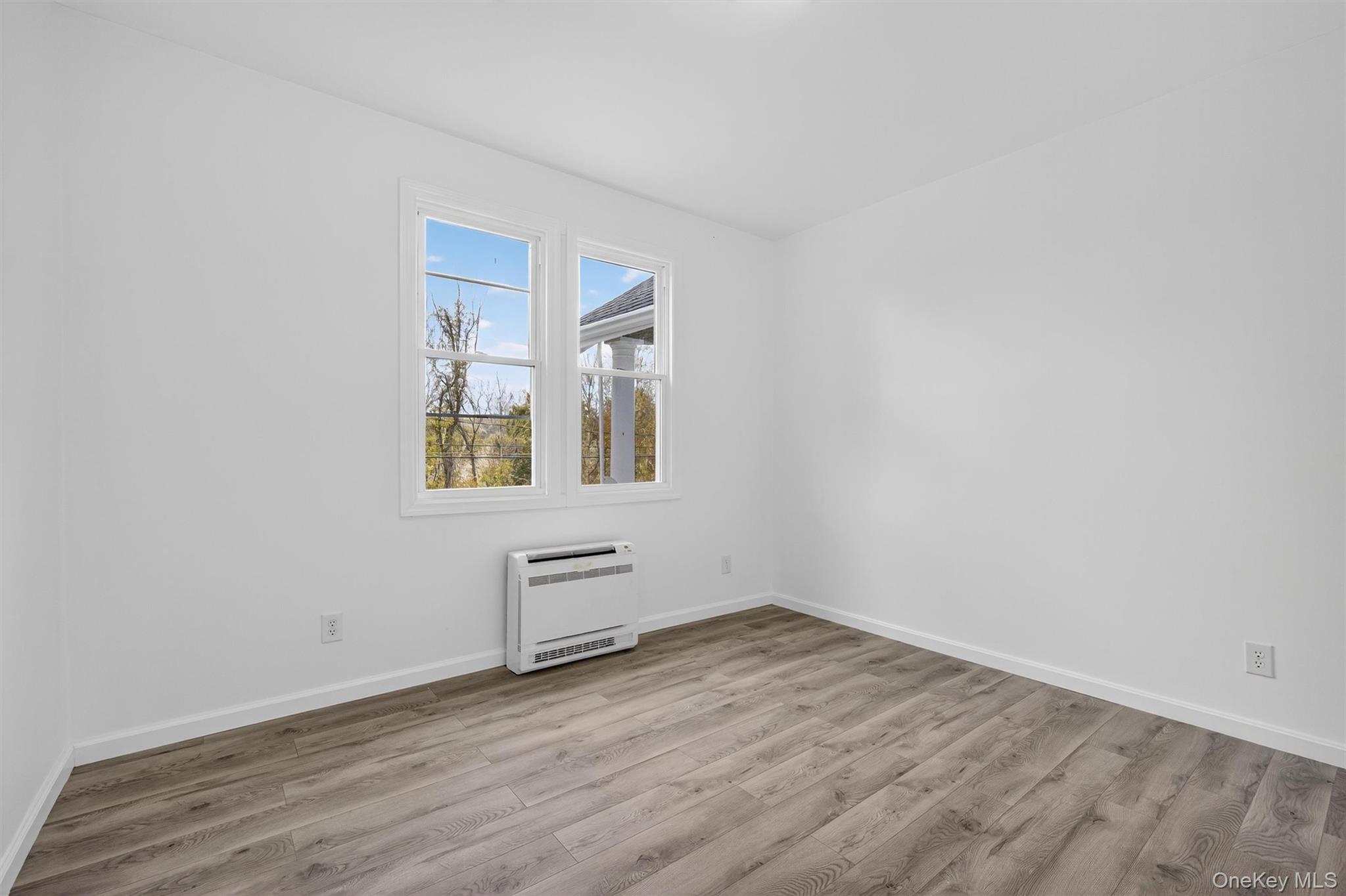 322 Old Rte 22 Pawling, NY 12564 - Photo 31 of 50 an empty room with wooden floor and windows