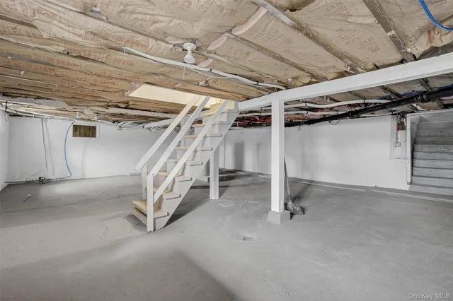 a view of an empty room with stairs