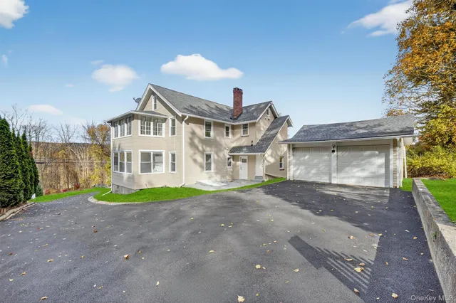 a view of a house with a yard and plants