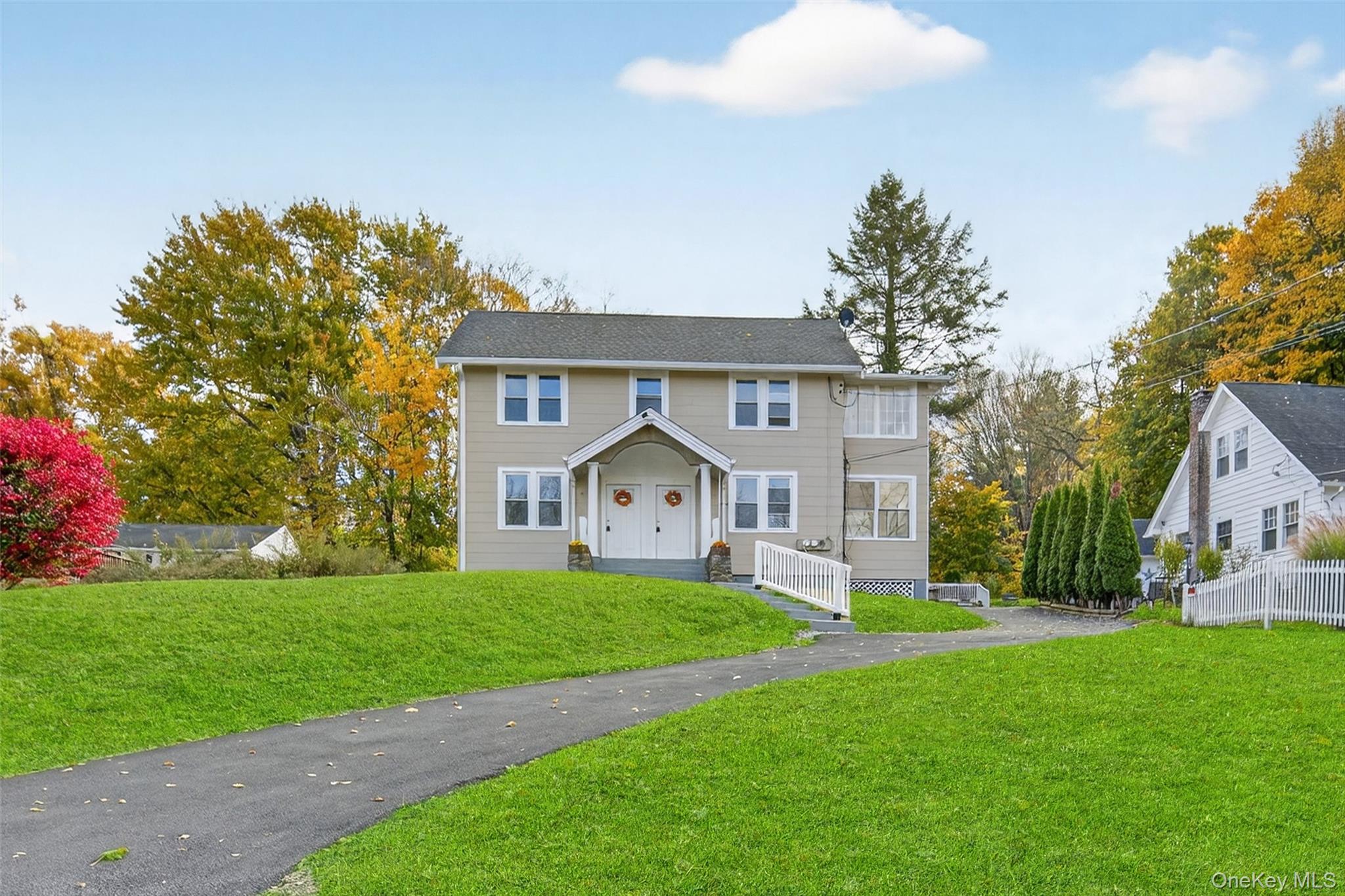 322 Old Rte 22 Pawling, NY 12564 - Photo 46 of 50 a front view of a house with a yard and trees