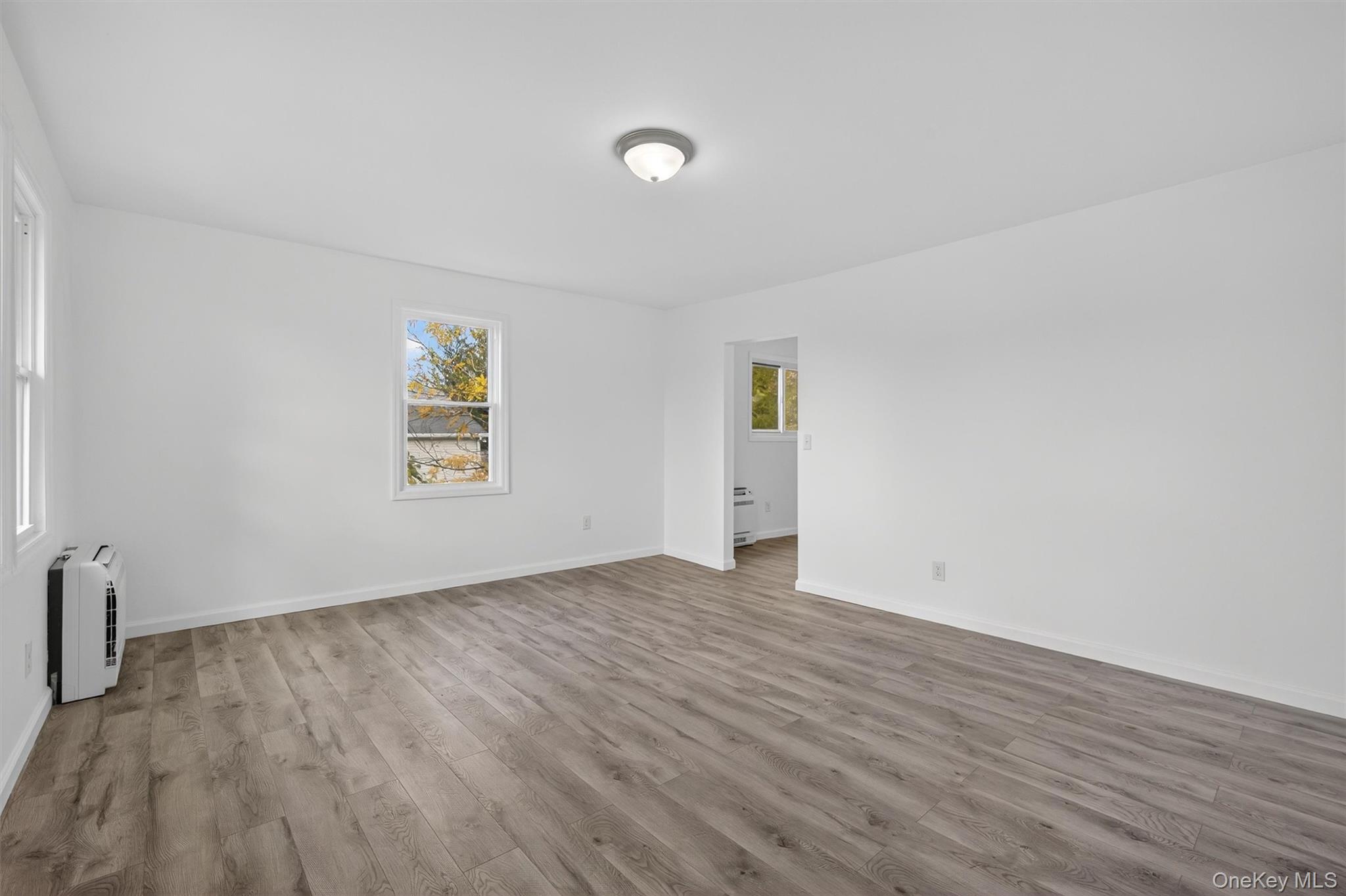 322 Old Rte 22 Pawling, NY 12564 - Photo 5 of 50 an empty room with wooden floor and windows