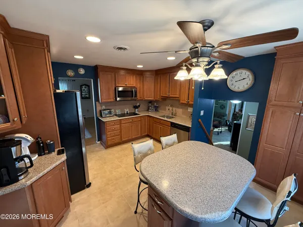 a kitchen with sink and cabinets