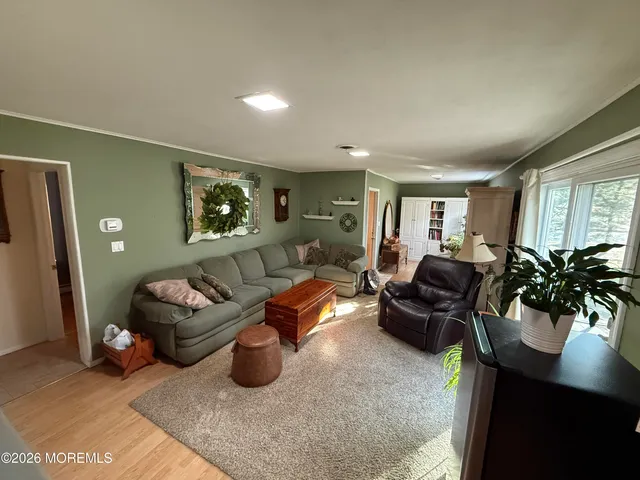 a view of a living room and a rug
