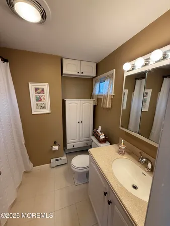 a bedroom with a bed and a mirror