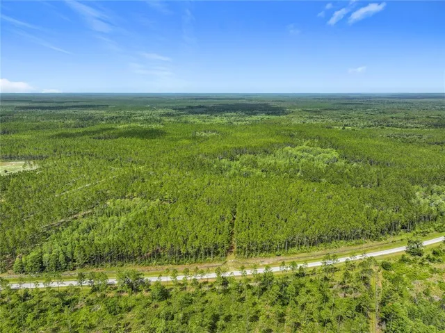 a view of an ocean and yard
