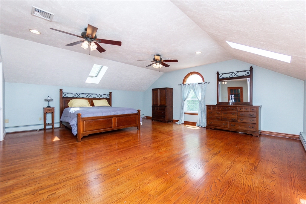 63 Bow Street Saugus, MA 01906 - Photo 13 of 42 a living room with furniture and a wooden floor