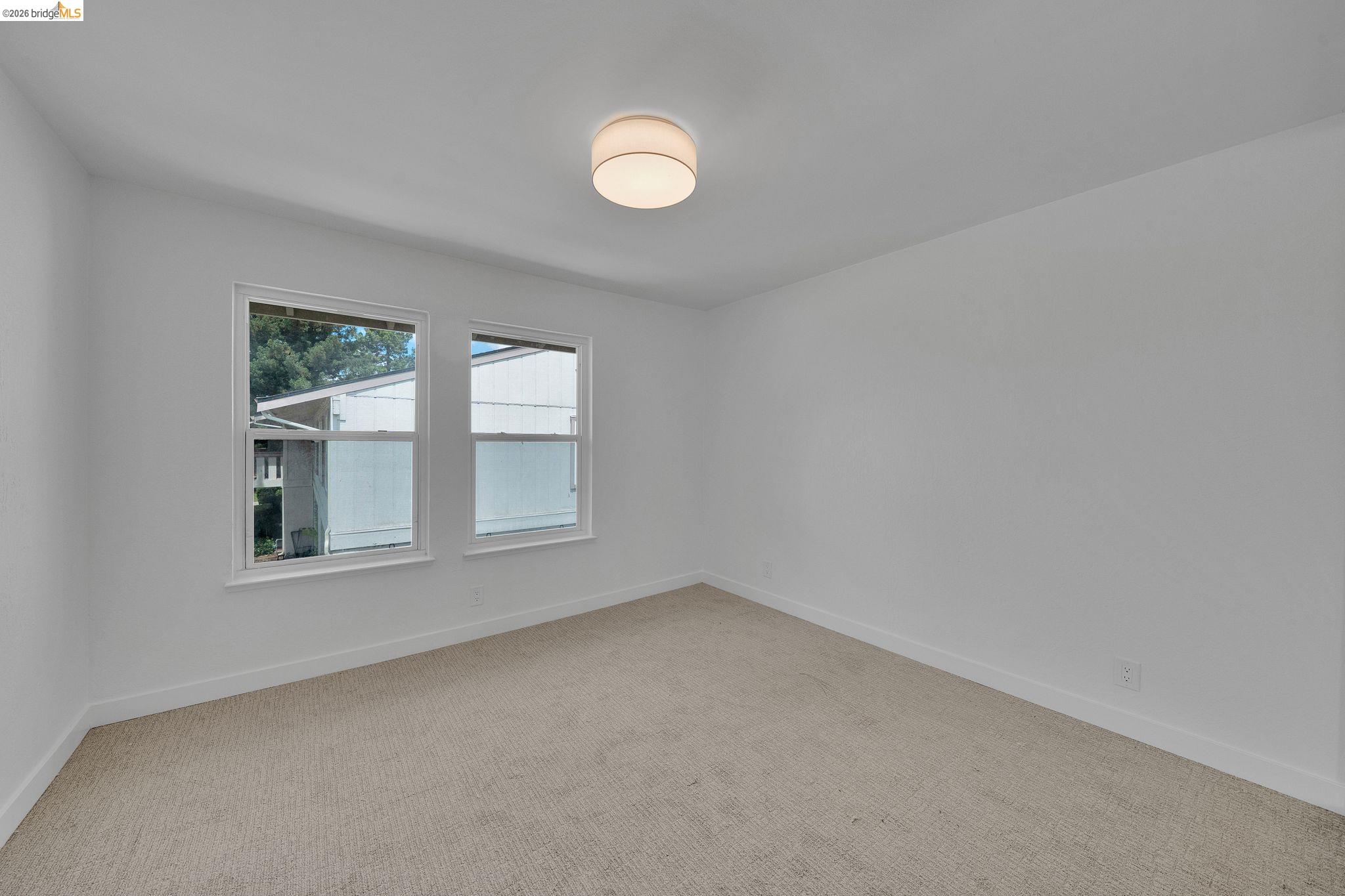 1808 Wildbrook Court, Unit D Concord, CA 94521 - Photo 27 of 47 an empty room with windows