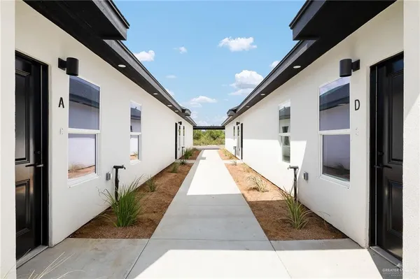 a view of hallway with seating area