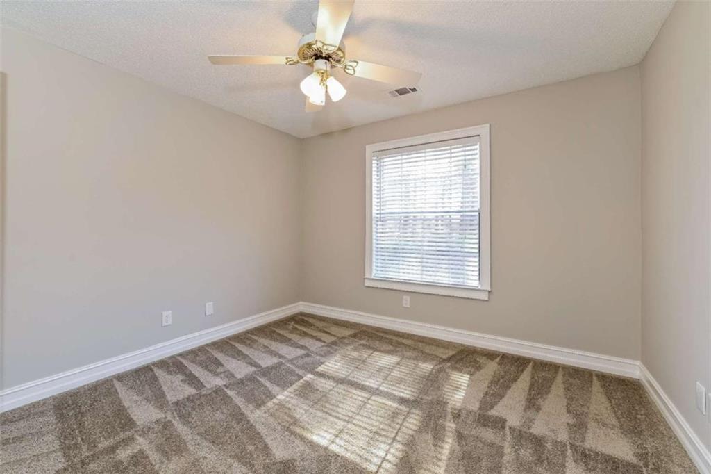 106 Emerald Lane Hampton, GA 30228 - Photo 15 of 19 a view of an empty room with a window