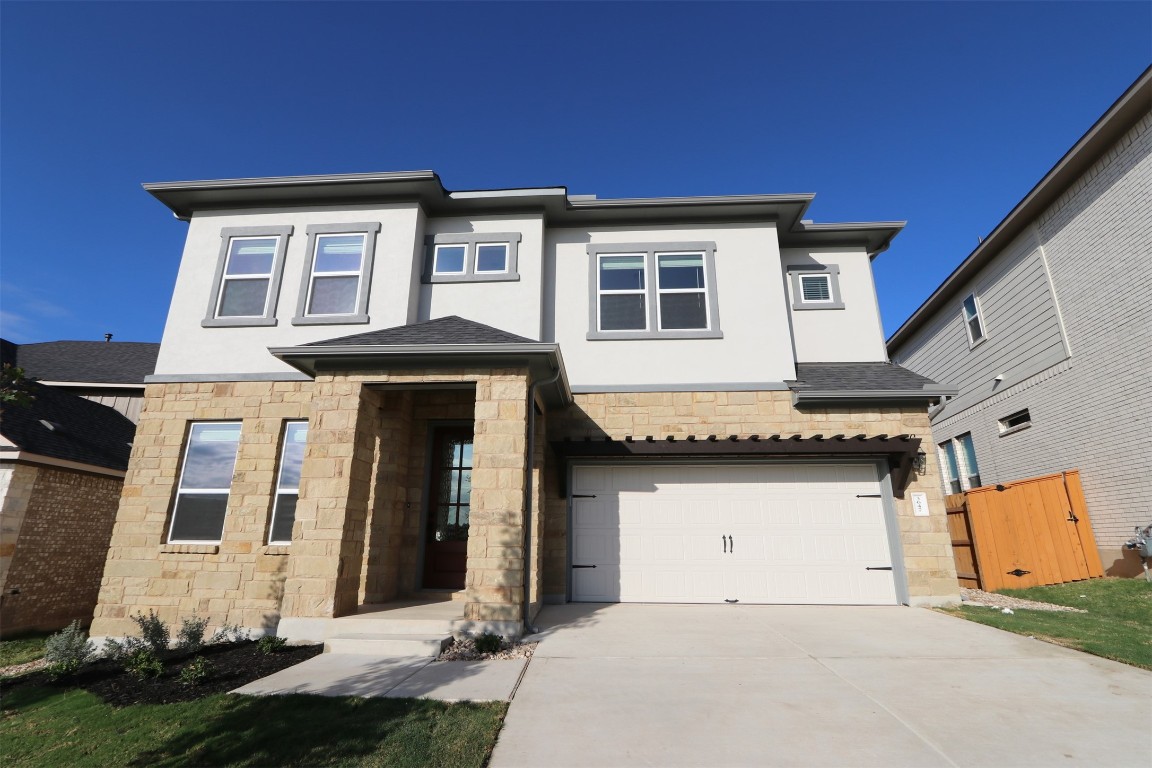 a front view of a house with yard
