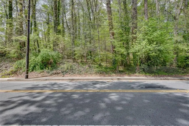 a view of a yard and a trees