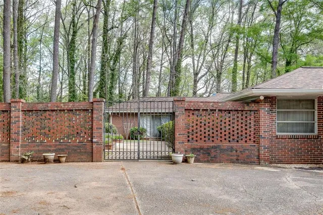 a view of a wrought iron fences in front of house