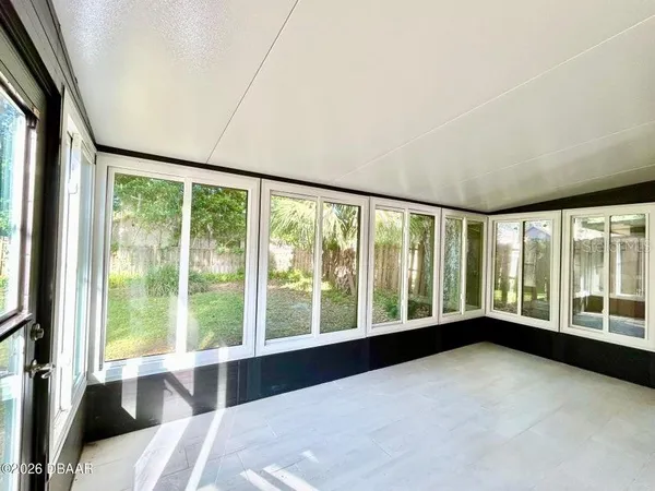 a view of an empty room with a large window