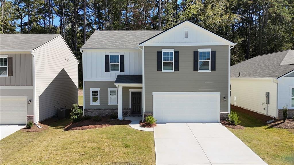 173 Hynes Street Winder, GA 30680 - Photo 1 of 20 a view of a white house with large windows and large tree