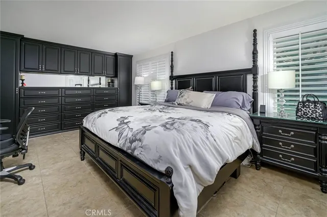 a bedroom with a bed and a closet