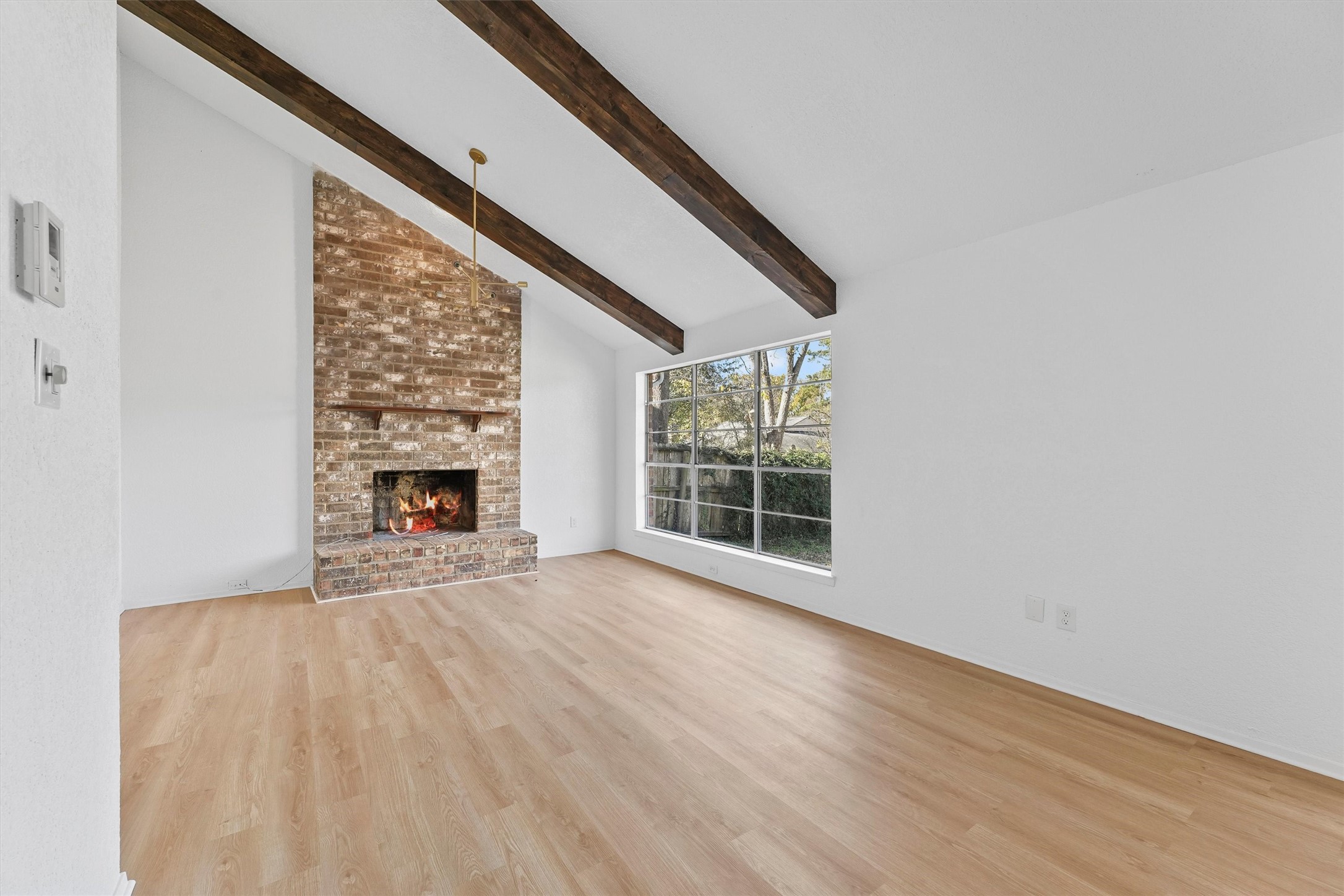 3223 Deer Valley Drive Spring, TX 77373 - Photo 11 of 25 a view of an empty room with wooden floor and a window