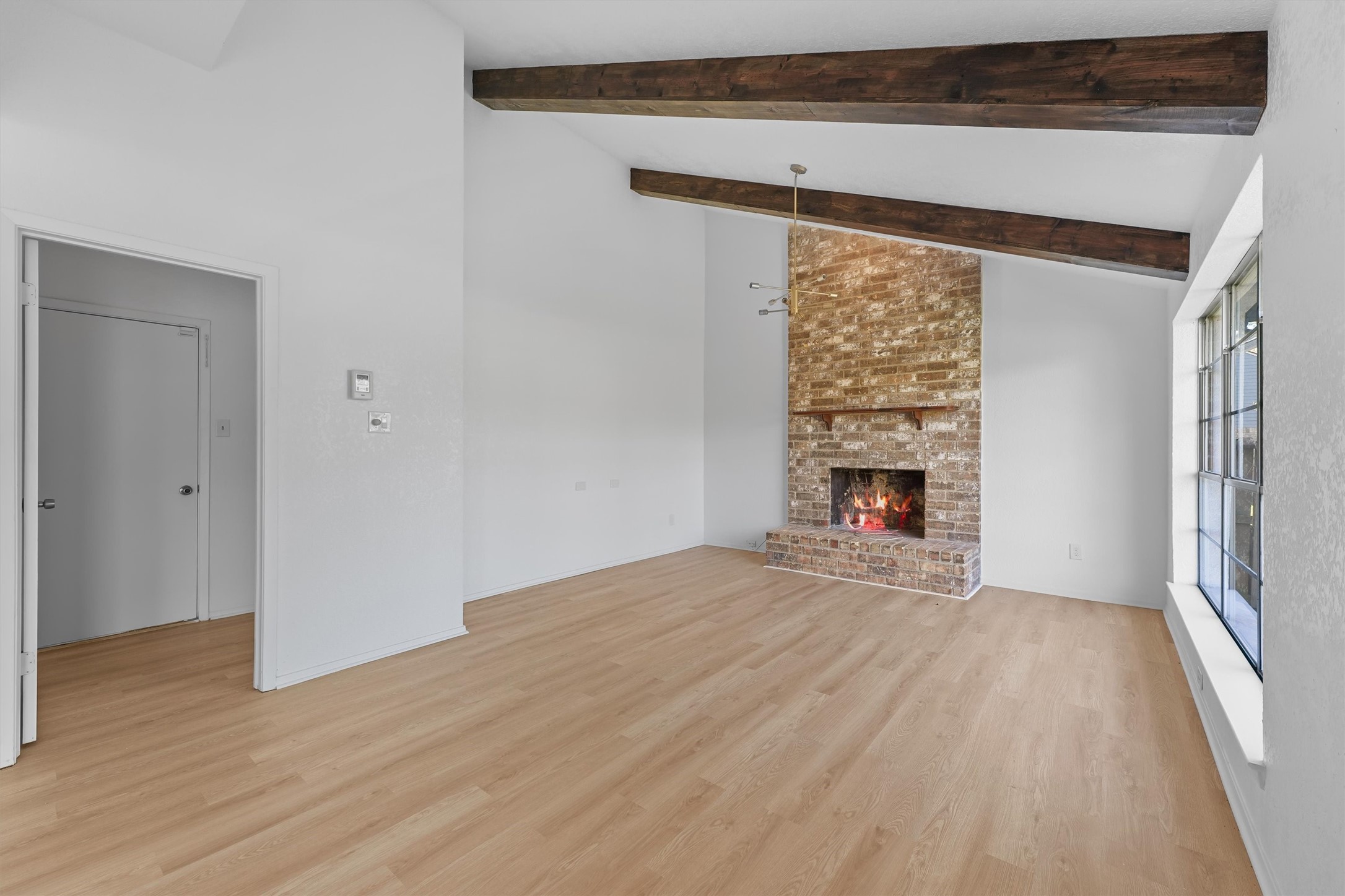 3223 Deer Valley Drive Spring, TX 77373 - Photo 12 of 25 a view of empty room with wooden floor and fireplace