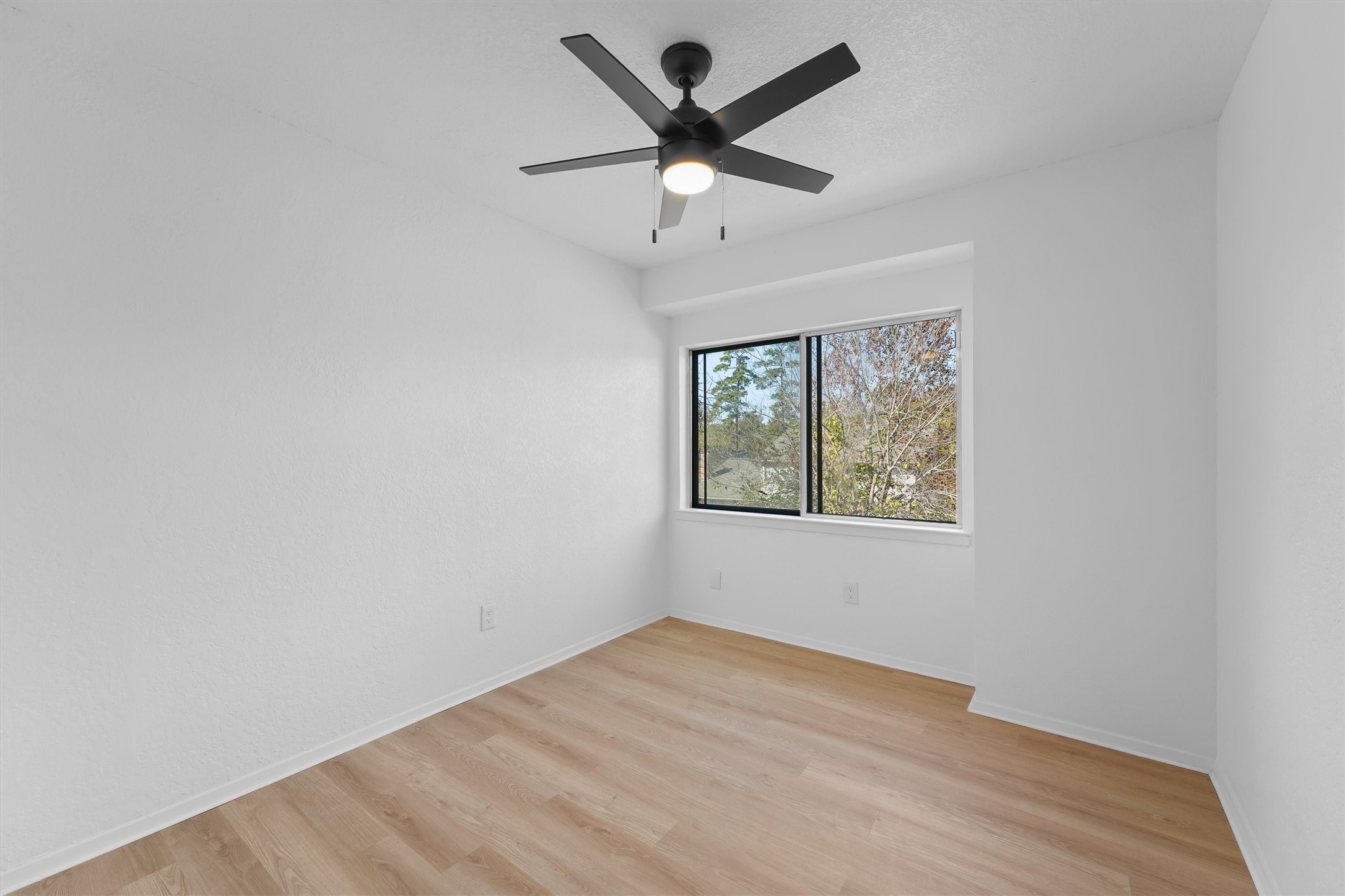 3223 Deer Valley Drive Spring, TX 77373 - Photo 15 of 25 an empty room with a window and a ceiling fan