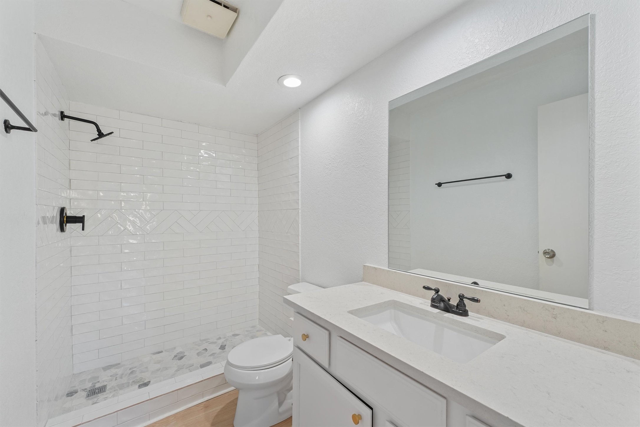 3223 Deer Valley Drive Spring, TX 77373 - Photo 16 of 25 a bathroom with a granite countertop sink a toilet and shower