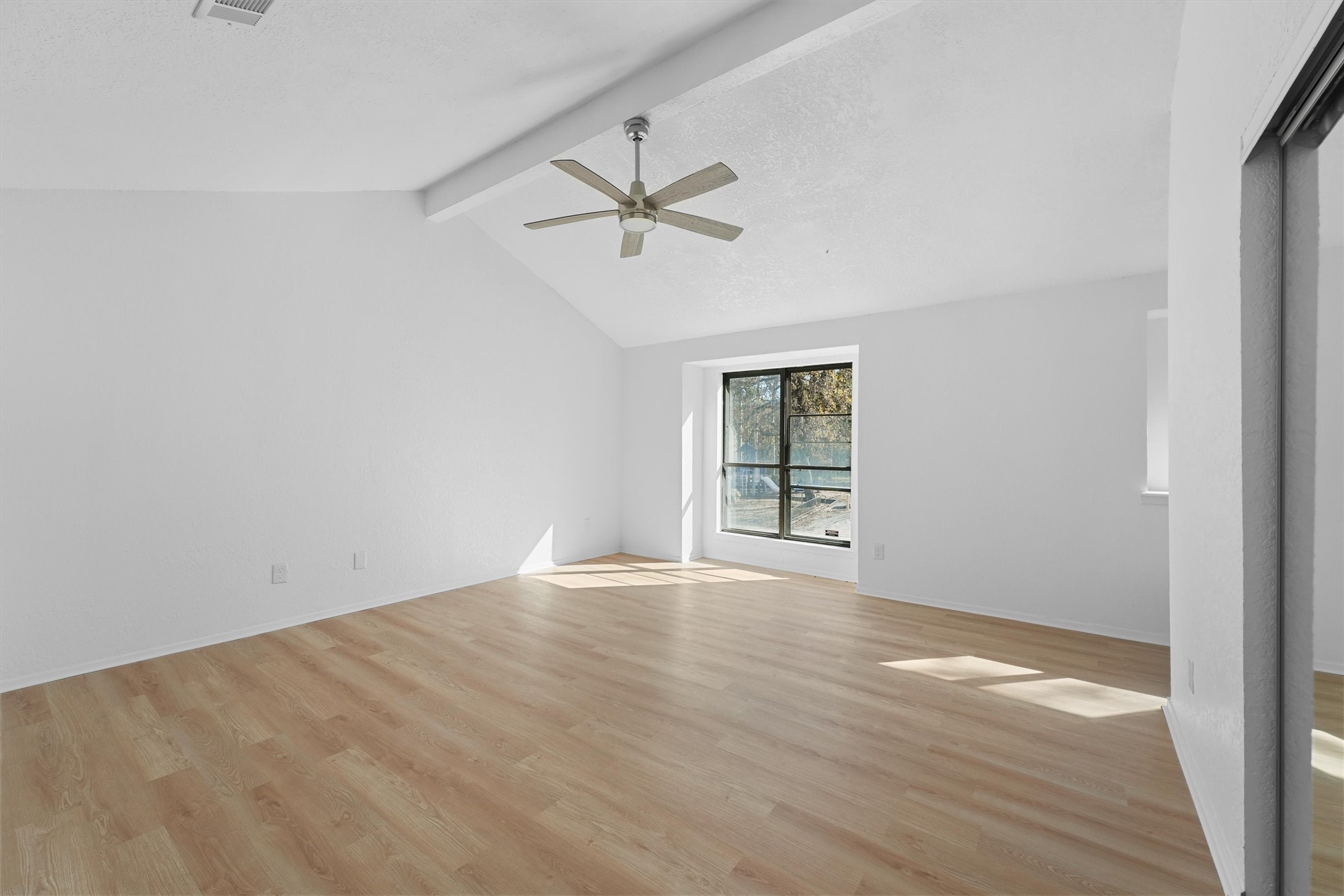 3223 Deer Valley Drive Spring, TX 77373 - Photo 19 of 25 wooden floor in an empty room with a window