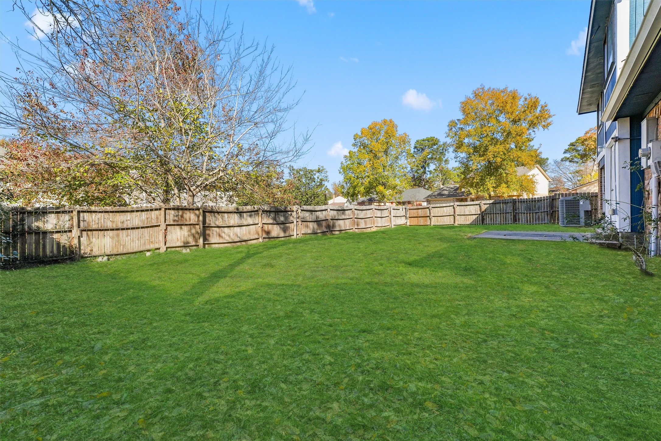 3223 Deer Valley Drive Spring, TX 77373 - Photo 23 of 25 a view of field with grass and trees in the background