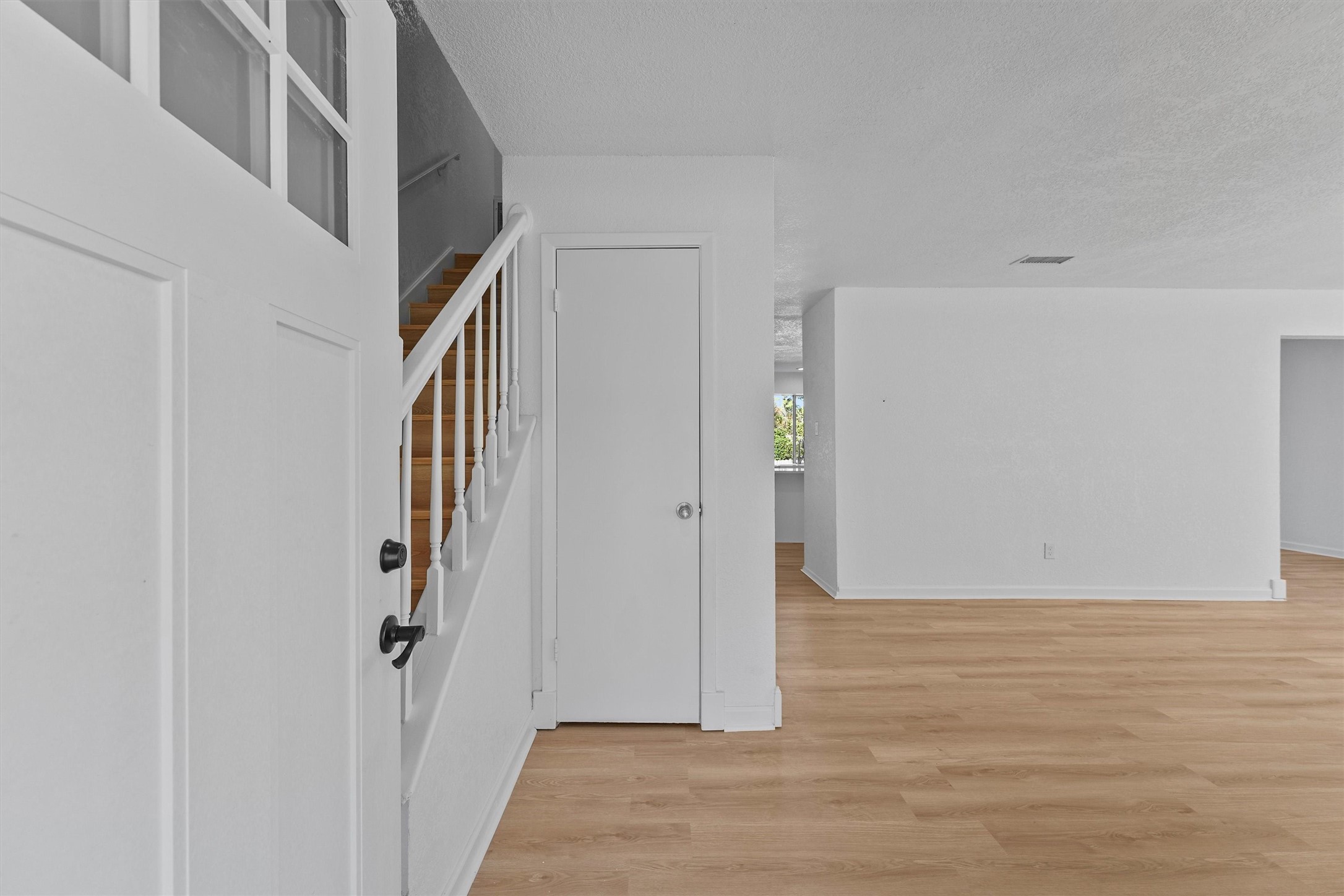 3223 Deer Valley Drive Spring, TX 77373 - Photo 3 of 25 a view of a hallway with wooden floor and entryway