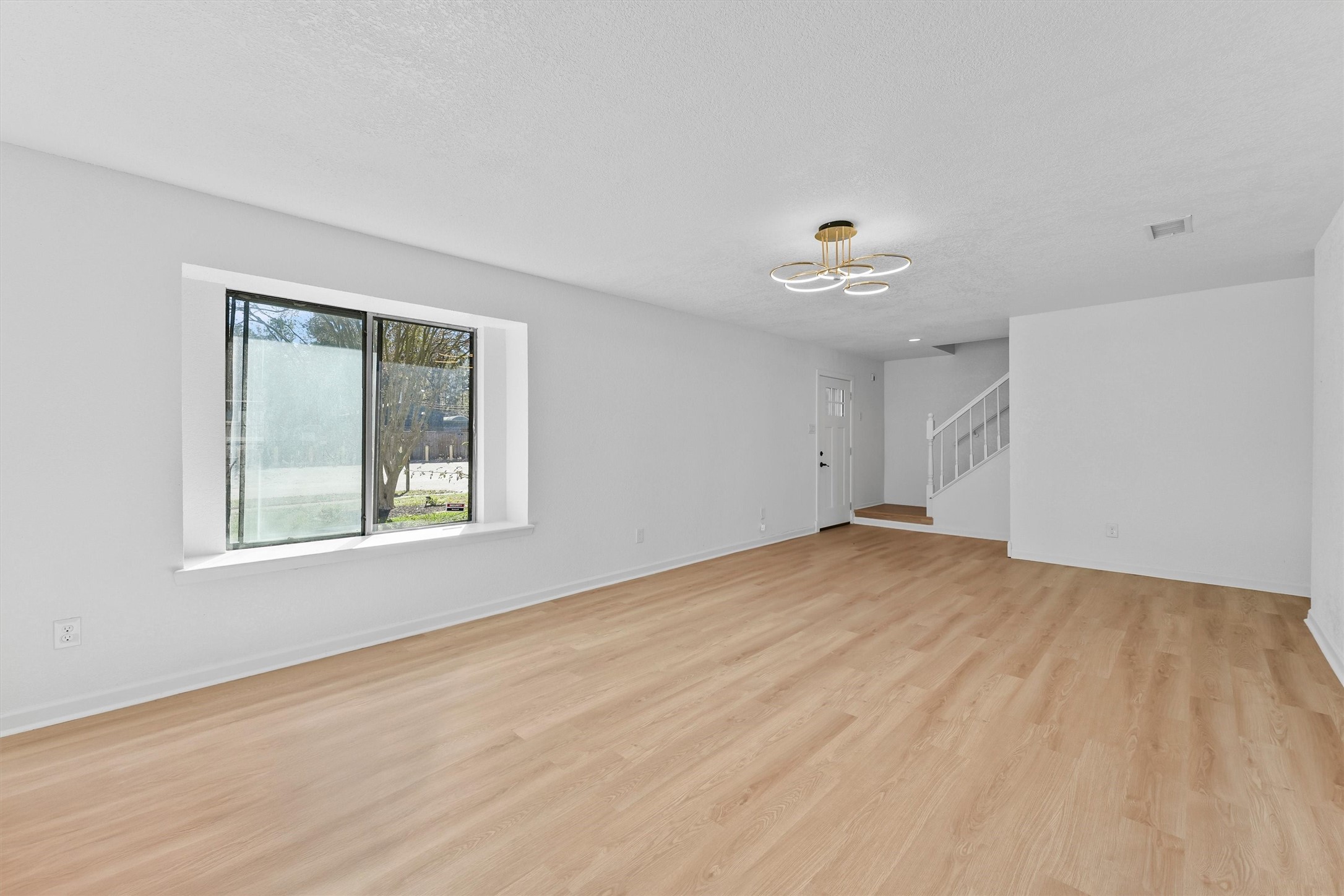 3223 Deer Valley Drive Spring, TX 77373 - Photo 5 of 25 a view of empty room with wooden floor and fan