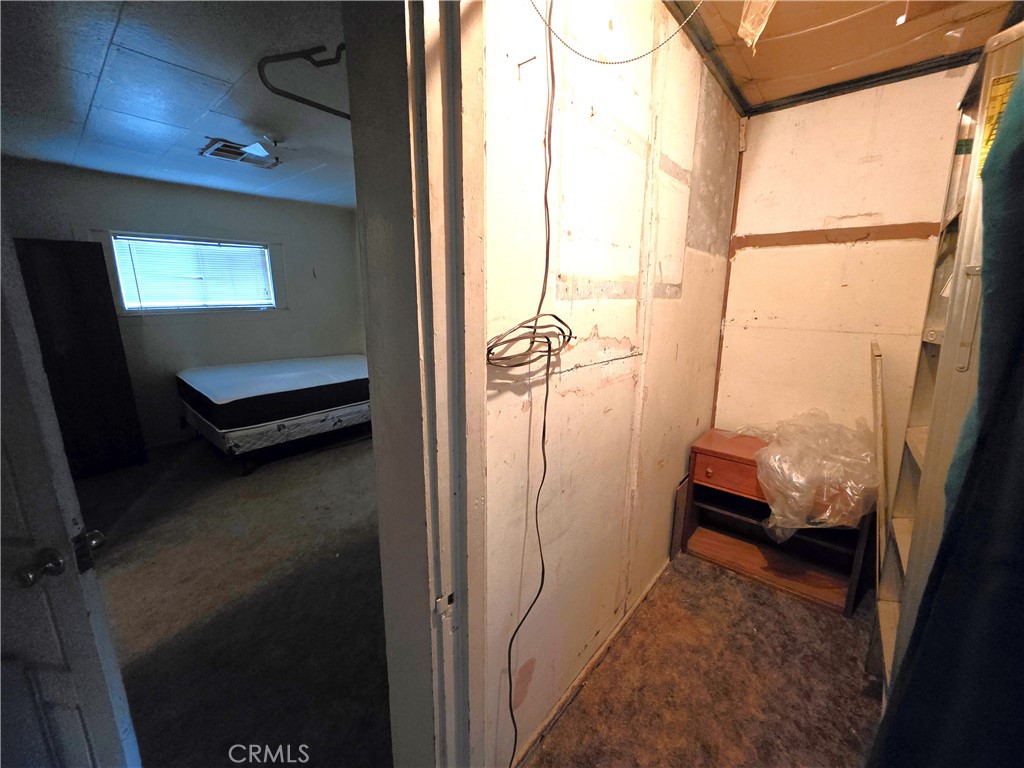 14055 Palm Street Cabazon, CA 92230 - Photo 16 of 22 a view of a balcony with chair and door