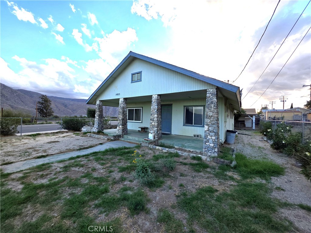 14055 Palm Street Cabazon, CA 92230 - Photo 20 of 22 a view of a house with backyard